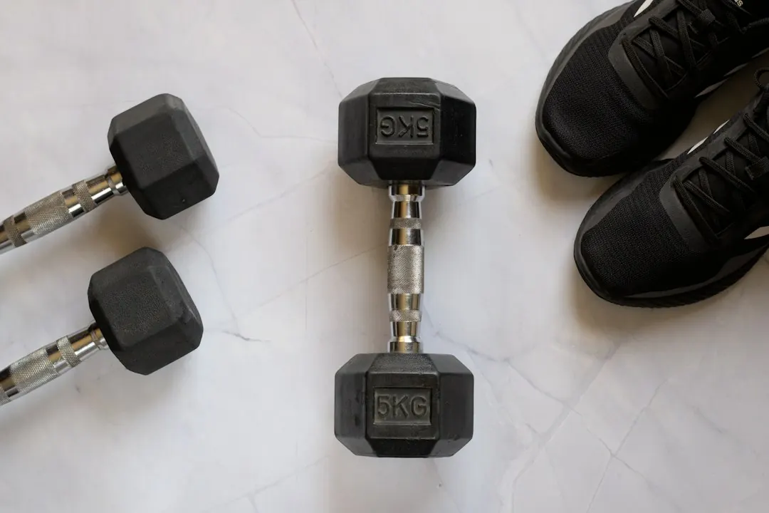Close up of an adjustable dumbbell set showing precise weight progression plates